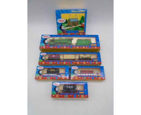 A collection of boxed Hornby OO gauge Thomas the Tank Engine &amp; Friends model railway items included Henry the Green Engin