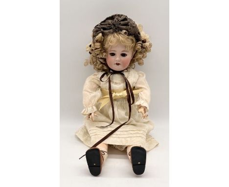 An SFBJ bisque headed doll marked Paris 60