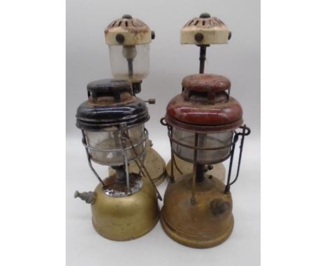 Four vintage oil lamp burners, two pairs, one shade missing. 