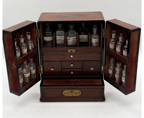 19th century mahogany travelling apothecary cabinet with recessed brass carry handle to top and twin deep section doors to fr