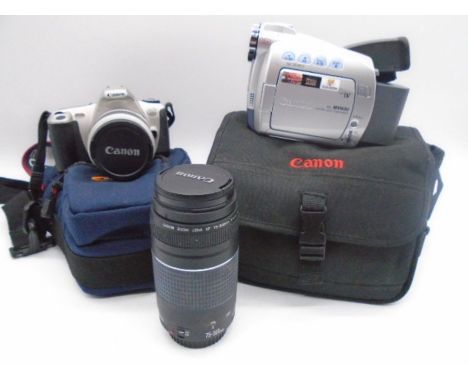 A canon EOS300 camera along with a Canon zoom lens (75-300mm) and a Canon MV600 camcorder 