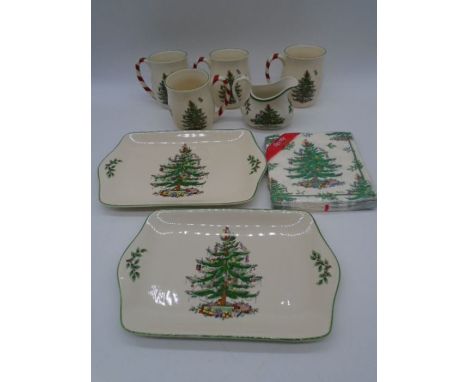 A collection of four Spode "Christmas Tree" mugs with candy cane handles, along with a similar creamer jug, two dishes and se