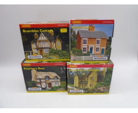 A collection of four boxed Hornby Skaledale OO gauge scale model buildings including Bramble Cottage (R8506), Holly Farm Cott