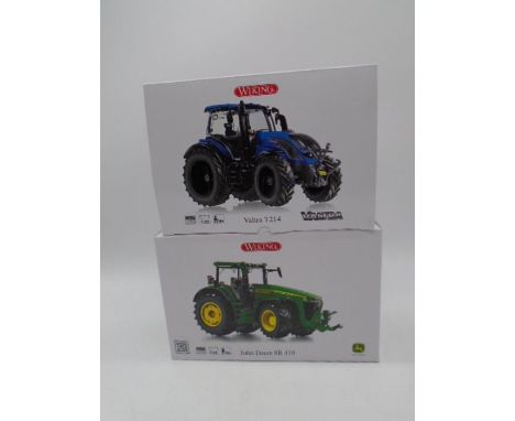 Two boxed Wiking die-cast tractors including a Valtra T214 and John Deere 8R 410 (both 1:32 scale)