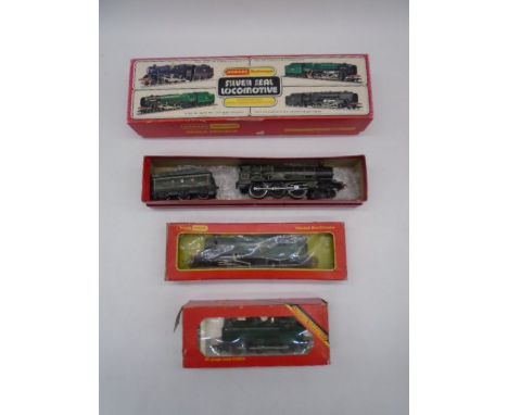 A collection of four boxed Hornby OO gauge model railway trains including "Oliver Cromwell" British Railway 4-6-2 locomotive 