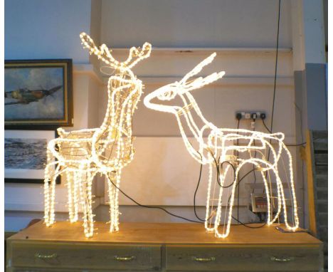 Two 3D rope light Christmas reindeer garden decorations with moving heads, length 100cm, height 125cm.