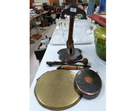 A 19th century wall mounted gong on cloven hoof bracket; oil lamps