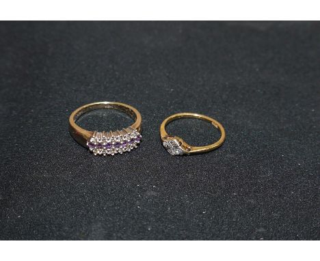 A 19th century hallmarked gold dress ring set central band of 7 amethyst coloured stones, flanked on either side with 6 small