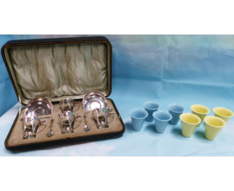 A cased set of 4 silver Art Nouveau coffee cups and saucers, with matching spoons and 2 sets of ceramic inserts, by Roberts &