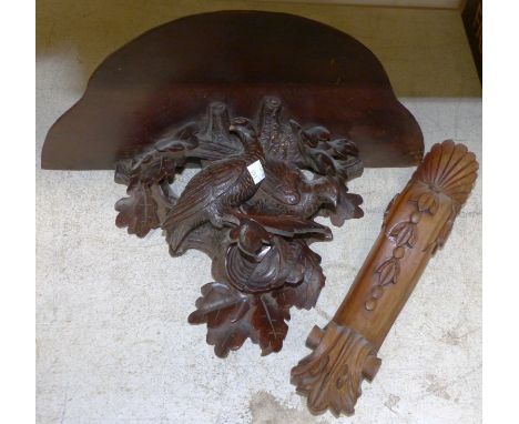 A late 19th century Black Forest carved wood wall bracket with ornate support depicting game birds, 10" (slight a.f.)