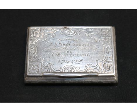 A chased silver bombé rectangular snuff box with presentation inscription, hinged lid and gilt interior, Birmingham 1876