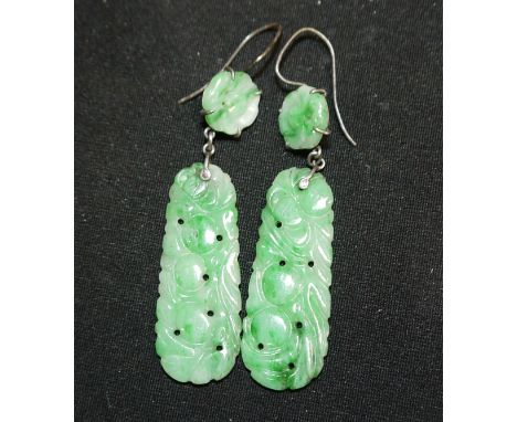 A pair of oriental jade pendant earrings in silver wire settings