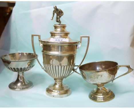 A hallmarked silver covered trophy cup with  man playing bowls as finial, 8.5", Birmingham, and 2 other plated trophies