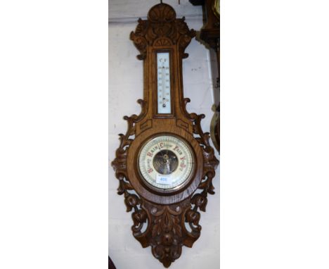 An early 20th century oak cased aneroid banjo barometer, 29"