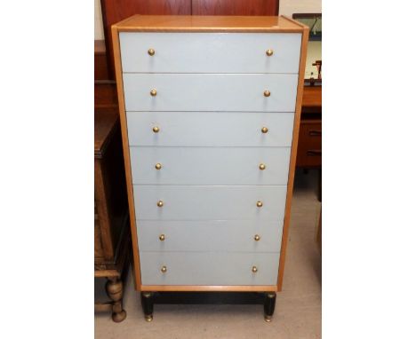 A 1960's narrow chest of drawers in light oak and grey