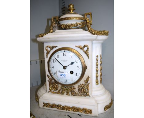 A 19th century Louis XVI style architectural mantel clock in white marble, with oval finial and extensive ormolu festoons and