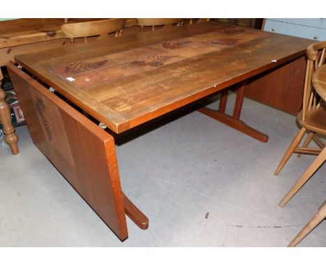 A mid-20th century Danish teak dining table by Gangsø Møbler, with central tile decoration and 2 detachable side leaves, exte