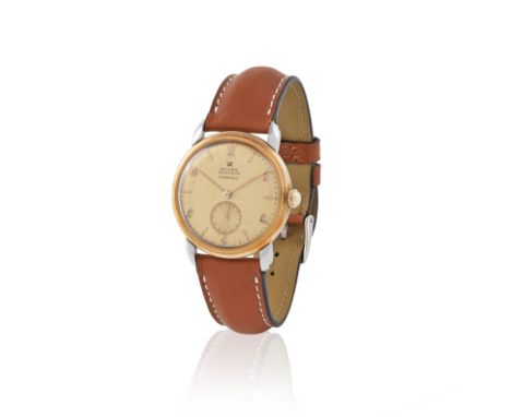 Rolex retailed by Bucherer. An 18K rose gold and stainless steel manual wind wristwatchRolex distribuée par Bucherer. Montre 