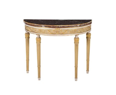 A WHITE PAINTED AND PARCEL GILT CONSOLE TABLE IN GEORGE III STYLE20TH CENTURYWith marble top86cm high, 105cm wide, 48cm deep 