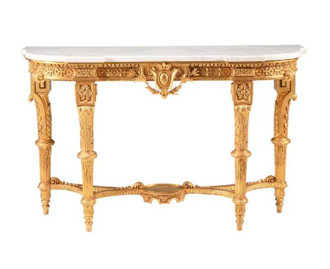 A GILT GESSO AND WHITE MARBLE CONSOLE TABLE IN LOUIS XVI STYLE 19TH CENTURY94cm high,154.5cm wide, 47.5cm deepProvenance: Pur