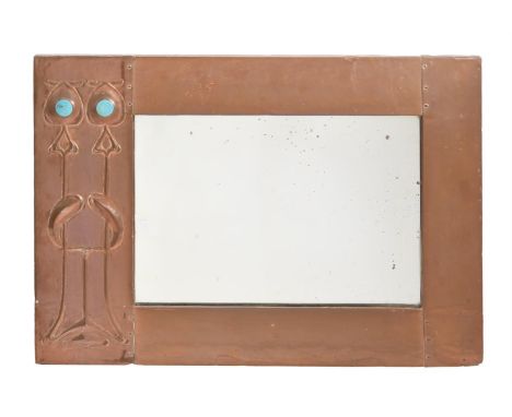 AN ARTS AND CRAFTS COPPER WALL MIRRORCIRCA 1900, POSSIBLY ARCHIBALD KNOX FOR LIBERTY Applied with enamel bosses tot he stylis