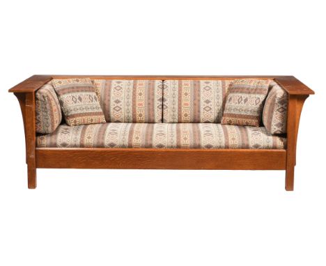 AFTER GUSTAV STICKLEY, AN OAK AND UPHOLSTERED 'TUB' SOFASECOND HALF 20TH CENTURY, IN ART DECO TASTEWith panel sides and back7