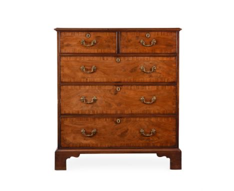 A GEORGE III MAHOGANY AND CROSSBANDED CHEST OF DRAWERS IN THE MANNER OF THOMAS CHIPPENDALE, CIRCA 1780 With gilt metal handle