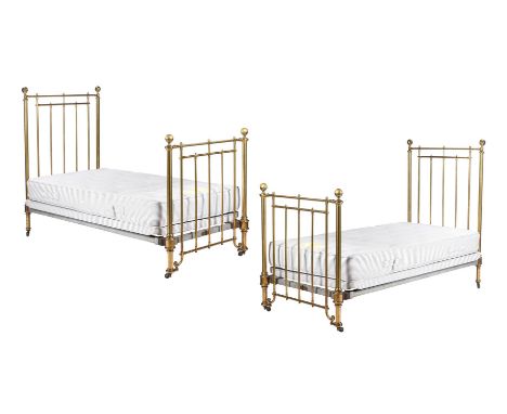 A PAIR OF EDWARDIAN BRASS SINGLE BEDSCIRCA 1905, by R W WinfieldOf traditional formThe headboard 145cm high, 97cm wideConditi