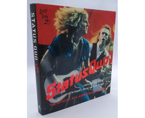 Status Quo 'Just Doin' It' 40th anniversary special edition book signed. First page appears signed by entire band including F