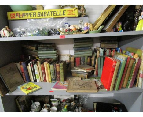 A shelf of mainly children's books and annuals to include T S Eliot's Old Possum's Book of Practical Cats, those by Arthur Ra