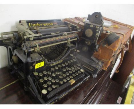 A mixed lot to include an Underwood typewriter, Baby Projector, two early 20th century hand lights and a leather suitcase 