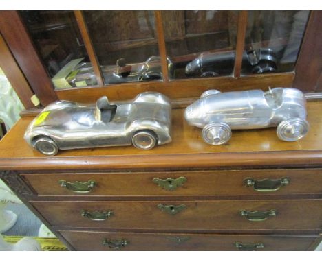 A Libra Distinctive Interiors metal model of a vintage two-seater car, along with a similar model of a vintage racing car 