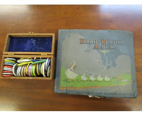A vintage Kiddie record album and a box of mid 20th century badges 