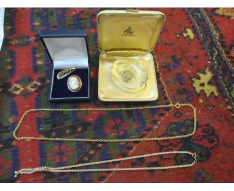 A 9ct gold plated bangle, an 18ct gold cameo, a 9ct gold chain, 4g, a 9ct locket 5.4g and yellow metal items 