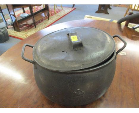 A Victorian cast iron cooking pot with twin handles and lid, Coat of Arms to front and back 