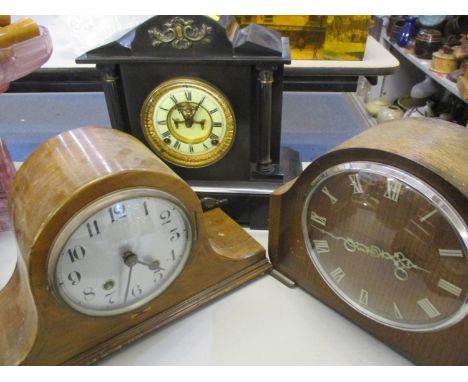 Three clocks to include a late 19th century black slate mantle clock and a 1930s and 1950s mantle clock 