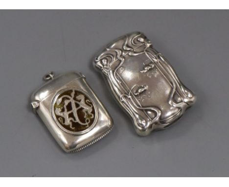 A late Victorian silver and enamel vesta case and an American Art Nouveau sterling vesta case, largest 6cm.