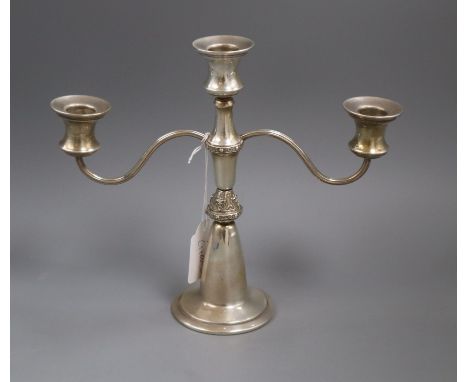 A modern silver two branch, three light candelabrum by Reid &amp; Sons, height 21.5cm.