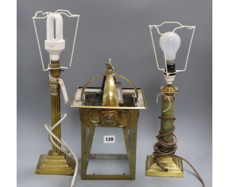 An Art Nouveau design brass hall lantern, a brass corinthian column table lamp and a brass and onyx table lamp