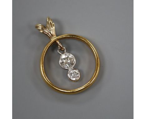 A 22ct gold wedding ring converted to a pendant and now set with two graduated diamonds, 26mm.