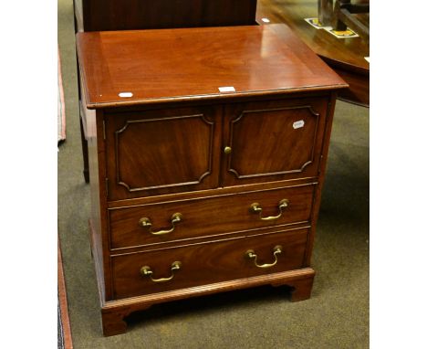A George III style mahogany commode with a cupboard over two drawers Back replaced, numerous alterations and additions. Top a
