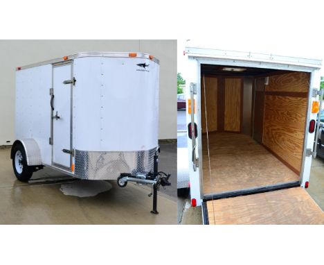 A cargo trailer, internal measurements 10ft by 5ft, fully lined with rear ramp door and side door, complete with external and