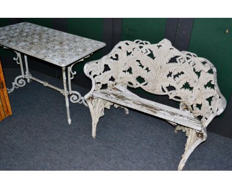 A Coalbrookdale style aluminum fern pattern garden bench and a white painted rectangular outdoor table (2) 