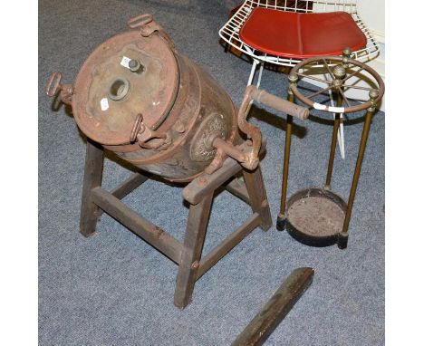 A butter churn on stand and a circular stick stand