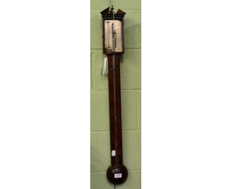 A mahogany stick barometer, signed Manticha & Co, circa 1820, broken arched pediment, exposed mercury tube with a single vern