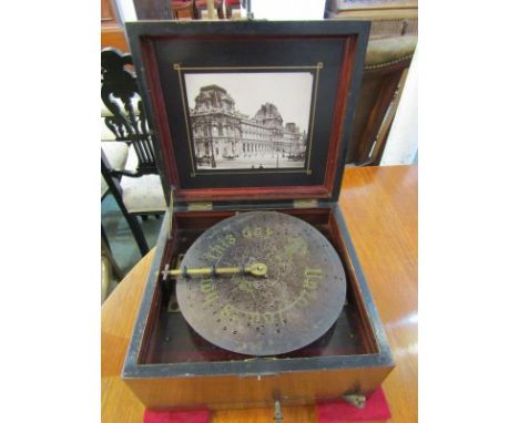 POLYPHON, inlaid mahogany tabletop polyphon with pictorial interior, together with collection of 32 x 8" metal discs 