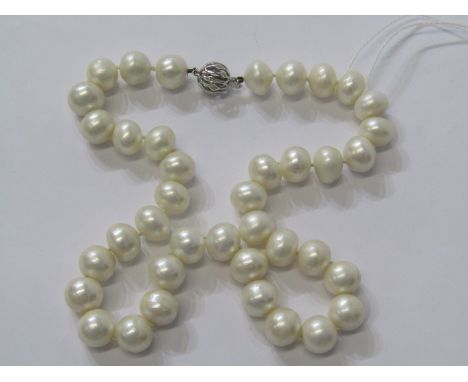 IMPRESSIVE PEARL NECKLACE, large cultured pearls held together by 18ct white gold clasp with accent illusion set diamonds 