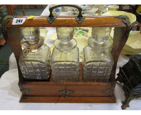 EDWARDIAN TANTALUS, triple decanter tantalus with plated mounts and key, 13" width 