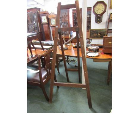 ARTIST EASEL, a stained pine artist easel, 69 " height 