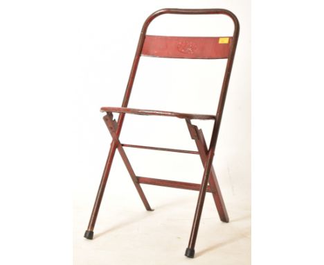 Star DVG - A vintage mid century metal folding chair. The chair having a tubular frame with panelled seat rest with all raise